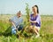 Woman with teenager son setting tree