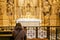 A woman in a temple prays to God. Woman praying in front of altar. Praying woman in front of altar. selected focus