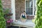 Woman tending to newly potted plants on her patio