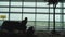 Woman at the terminal window at the airport