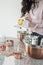 Woman testing a lemon in the kitchen