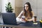 Woman texting on smartphone during lunch break at workplace. Manager in office calling customers in front of laptop. Female using