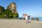 Woman with Thailand flag enjoying trip to Krabi beach