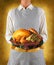 Woman With Thanksgiving Turkey on Platter