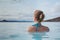 Woman in thermal natural hot spring spa in Iceland, blue lagoon