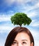 Woman thinking idea growth tree on her\'s head.