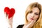 Woman thinking about love holding heart