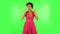 Woman thinks about something, no idea. Green screen