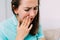 Woman thirties years old suffers from toothache and caries
