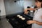 woman with Three arepas on the grill