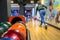 Woman throwing bowling ball