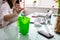 Woman Throwing Crumpled Paper In Dustbin