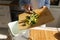 Woman throwing cucumber peels into composter bin. Female composting organic food waste at home. Person using bokashi container for