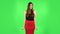 Woman throwing up hands expressing she is innocent, saying oops she doesn`t know what`s going. Green screen