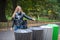 Woman throws recycle paper trash in the trash sorting waste