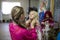 A woman ties a scarf to a little girl for going to church