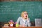 Woman tired teacher sit table classroom chalkboard background. Working conditions for teachers. Work far beyond the