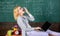 Woman tired teacher work laptop classroom chalkboard background. Working conditions for teachers. Working conditions