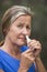 Woman tissue in nose suffering flu or hayfever