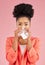 Woman, tissue and sneeze in studio portrait for healthcare, hygiene and allergy by pink background. African gen z girl