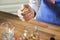 Woman about to pour walnuts into a jar.