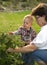 Woman and toddler picking berries