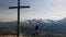 woman on top of Piz Scalottas Swiss flag