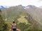 Woman at the top of Wayna Picchu mountain in Machu Picchu