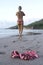 Woman topless beach with bikini on sand