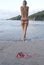 Woman topless tropical beach bikini on sand