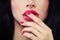 Woman Touching her Lips her Hand with Manicure