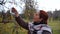 Woman touching ripe hawthorn.