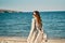 woman tourism travel sea sand beach mountains fresh air relax