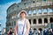 Woman tourist on the background of the Colosseum in Rome