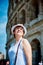 Woman tourist on the background of the Colosseum in Rome