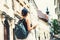 Woman tourist with backpack on street of Ljubljana, Slovenia.