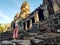 Woman tourist in Bayon temple in Angkor Wat