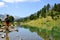 Woman tourist at the beautiful mountain lake in Neouvielle national nature reserve,French Pyrenees.