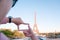Woman tourist in Eiffel tower, Paris landmark, sightseeing in France