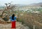 Woman tourist enjoying bird eye view of Pushkar lake or Pushkar Sarovar at Pushkar - Rajasthan - India