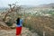 Woman tourist enjoying bird eye view of Pushkar lake or Pushkar Sarovar at Pushkar - Rajasthan - India