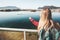 Woman tourist hand showing at seal in ocean