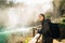 Woman tourist hiker visiting a mountain national park waterfall trail.Adventure tourist exploring nature.Nature and environment