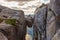 Woman tourist on Kjeragbolten Travel Norway Kjerag mountains