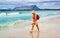Woman Tourist at La Cinta beach at Mediterranean Sea reflex