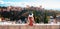 Woman tourist looking at Ancient arabic fortress Alhambra