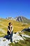 A woman tourist in the Montenegrin national park Durmitor against the backdrop of Mount Prutas