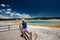 Woman tourist overlooking thermal spring in Yellowstone