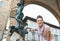 Woman tourist pointing on statue of Perseus, Florence, Italy