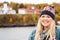 Woman tourist poses for a photo near the Rasperry Island Lighthouse while on a boat cruise of the Apostle Islands in Wisconsin USA